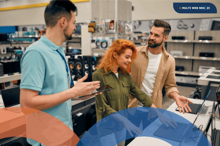 Clienti che interagiscono con un commesso in negozio di elettronica, simbolo del customer journey e della relazione diretta con il cliente.
